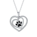 Women's necklace with a heart-shaped dog paw print copper pendant on a cross chain.