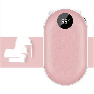 Compact rose gold USB rechargeable hand warmer and power bank with digital display on a wooden table.