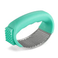 Stainless steel garlic press in green, showing compact 11cm design for crushing garlic.