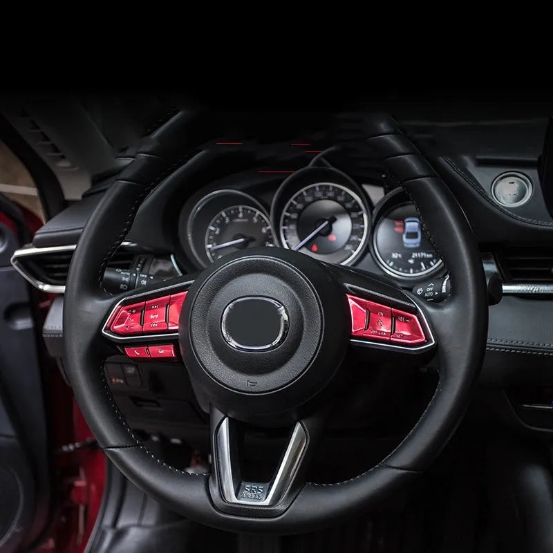 Atz modified vehicle steering wheel decorative sticker set showing aluminum alloy hollow button styles in brushed red, silver, and blue finishes