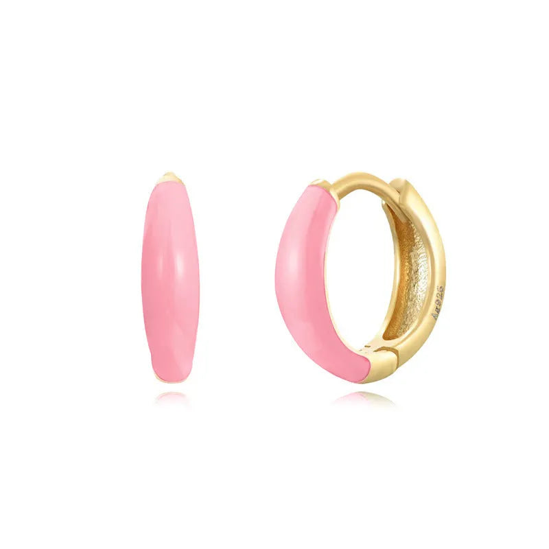 Geometric U-shaped oval epoxy earrings in dripped oil colours on copper wire.