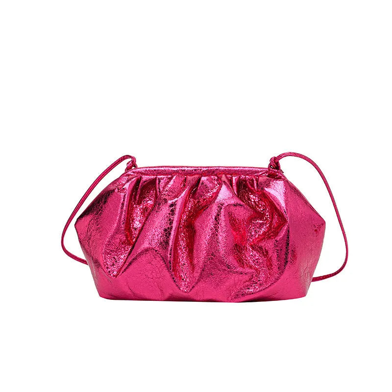 Simple hair clip fastening crossbody bag in shell shape, shown in rose red colour.