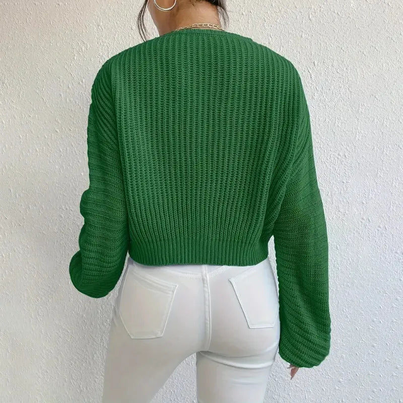 Women's solid colour long sleeve pullover top in polyester, shown in available colours.