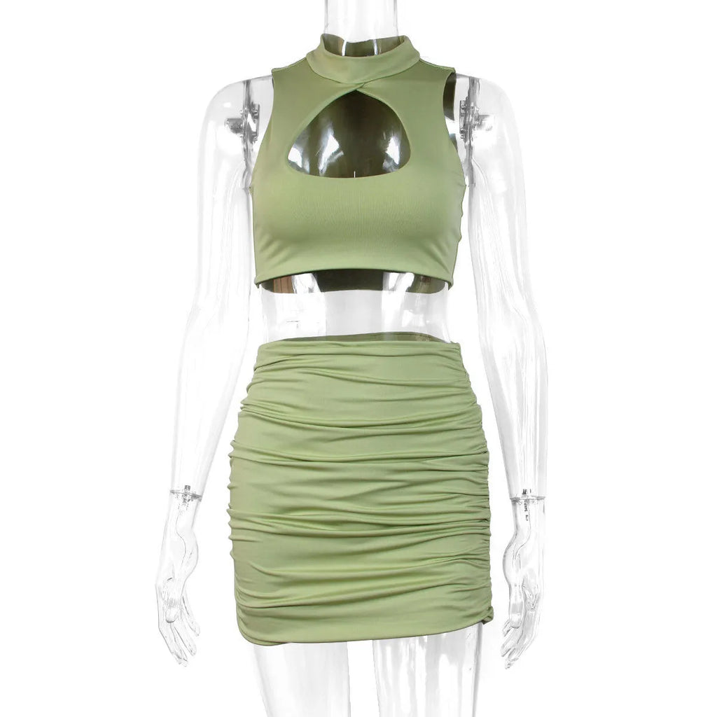 Light purple women's hollow vest and matching split skirt two-piece set on a hanger.