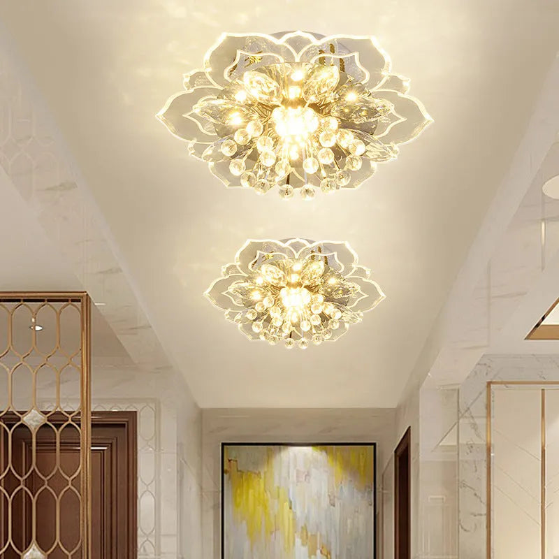 Small modern crystal ceiling lamp with flower-shaped shade in crystal, acrylic, and stainless steel materials