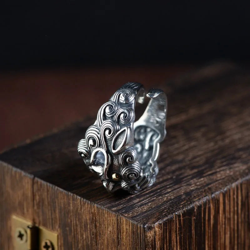Personalised silver open ring with a detailed jibeast or animal zodiac pattern on a retro-style band.