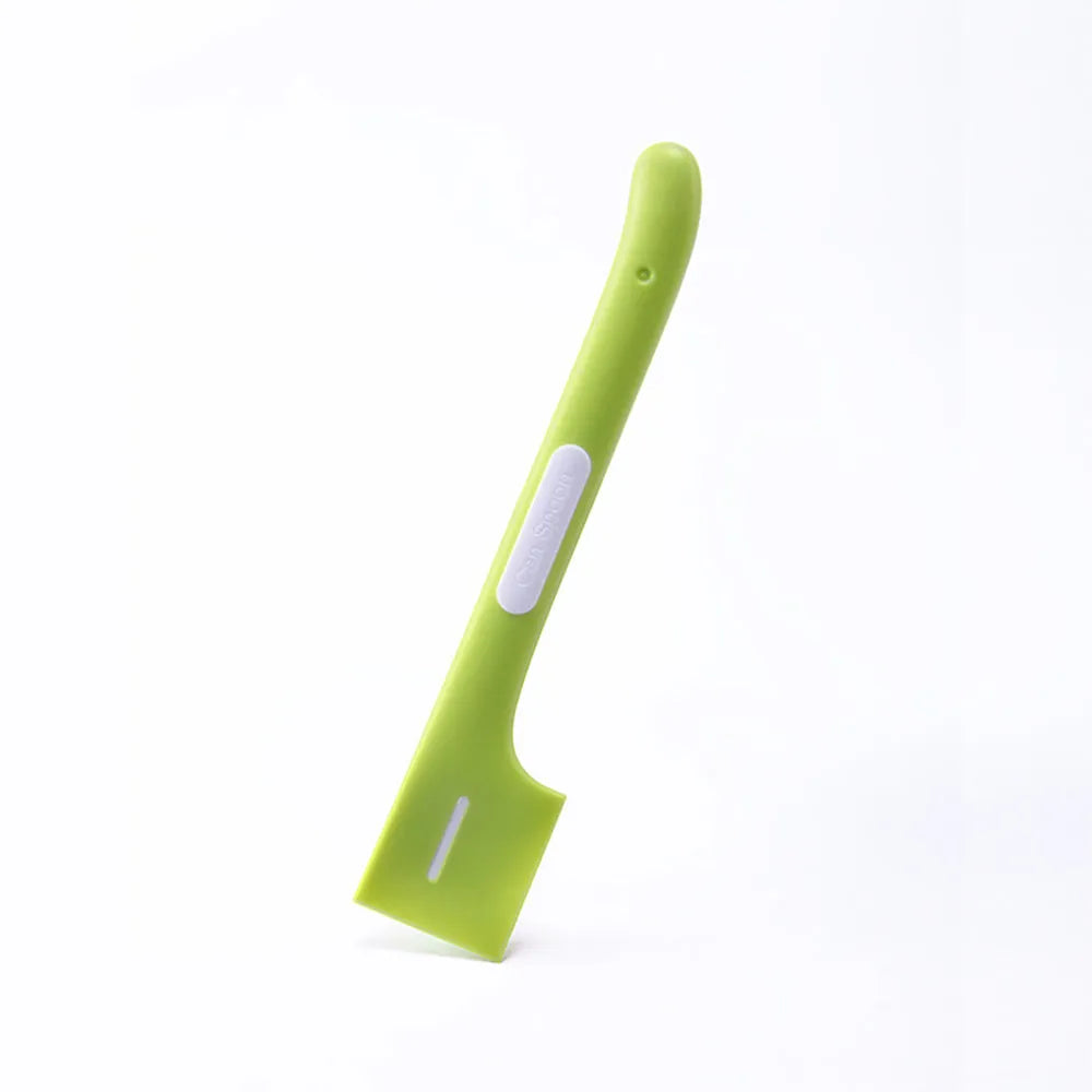 Green long-handle pet feeding spoon for canned cat and dog food on a white background.