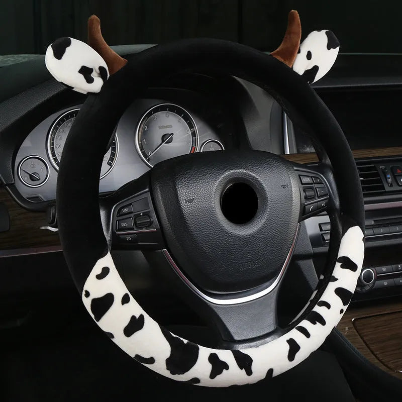 Black short plush car steering wheel cover shown on a vehicle steering wheel