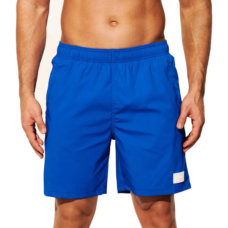 Men's quick-drying nylon shorts in solid colours with straight leg opening for beach and sports
