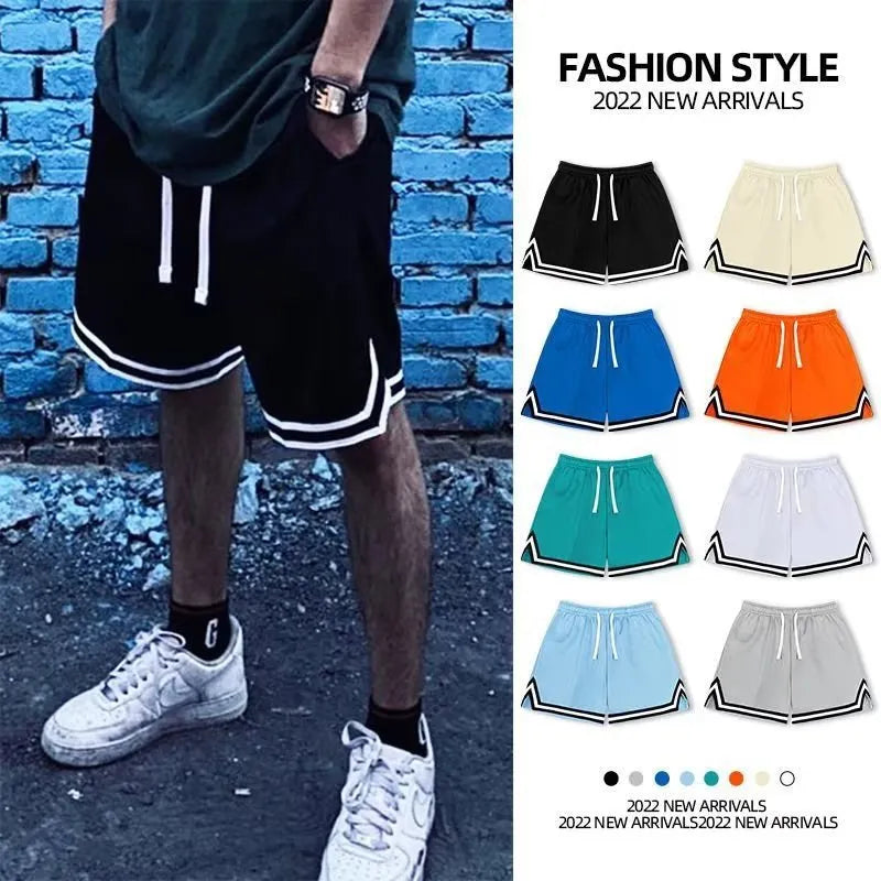 Man wearing loose-fit grey polyester leisure shorts overalls for summer sports.