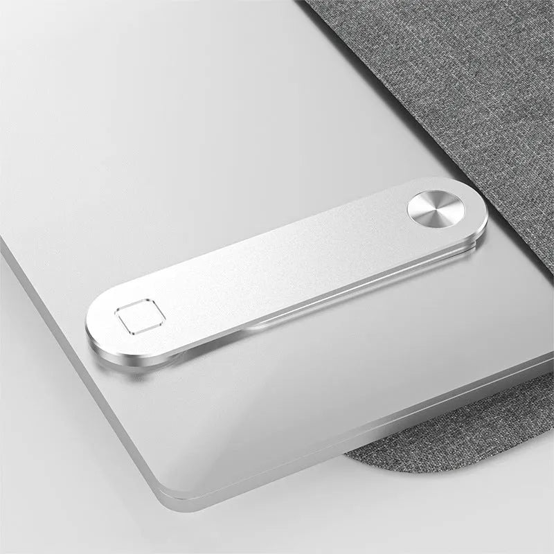 Black aluminum laptop phone holder with magnetic mount attached to computer monitor