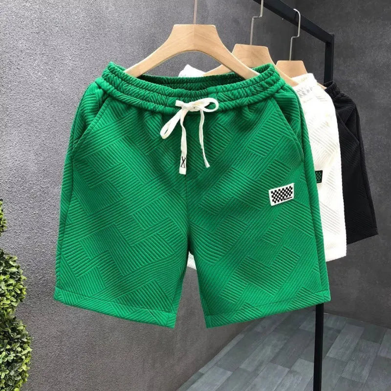 Casual solid colour sports shorts made from elastic polyester fabric.
