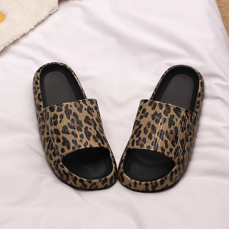Women's leopard print EVA slippers with a thick sole on a plain background.