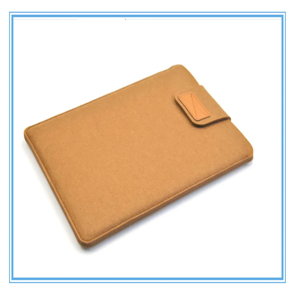 Dark grey clamshell laptop bag open to show interior laptop compartment and corner protector.