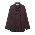 Brown women's poplin shirt with a bow tie, cardigan-style front, and long sleeves.