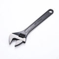 High-carbon steel open-end adjustable wrench with black finish on ergonomic handle.
