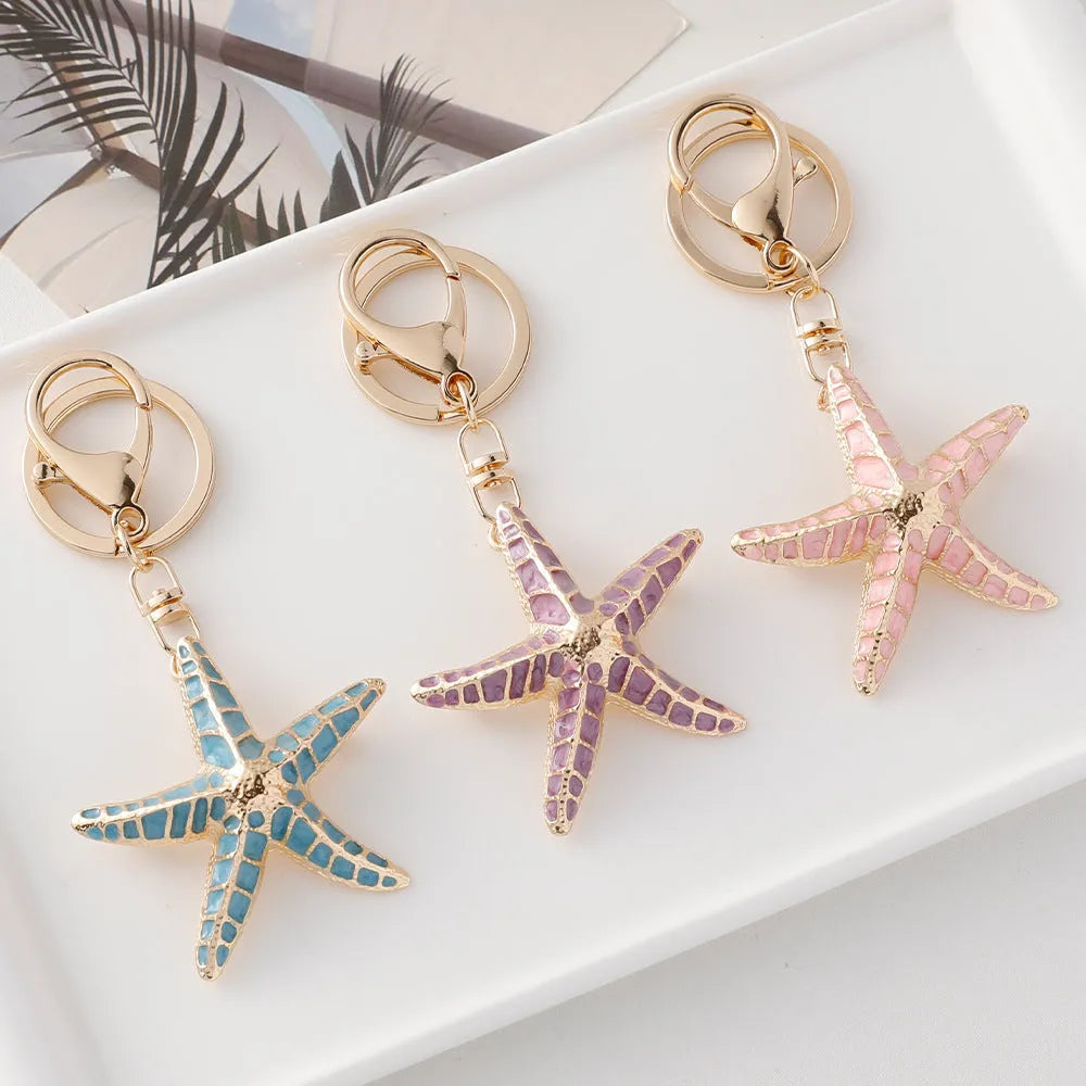 Ocean Series starfish keychain with electroplating finish in blue colour for luggage decoration