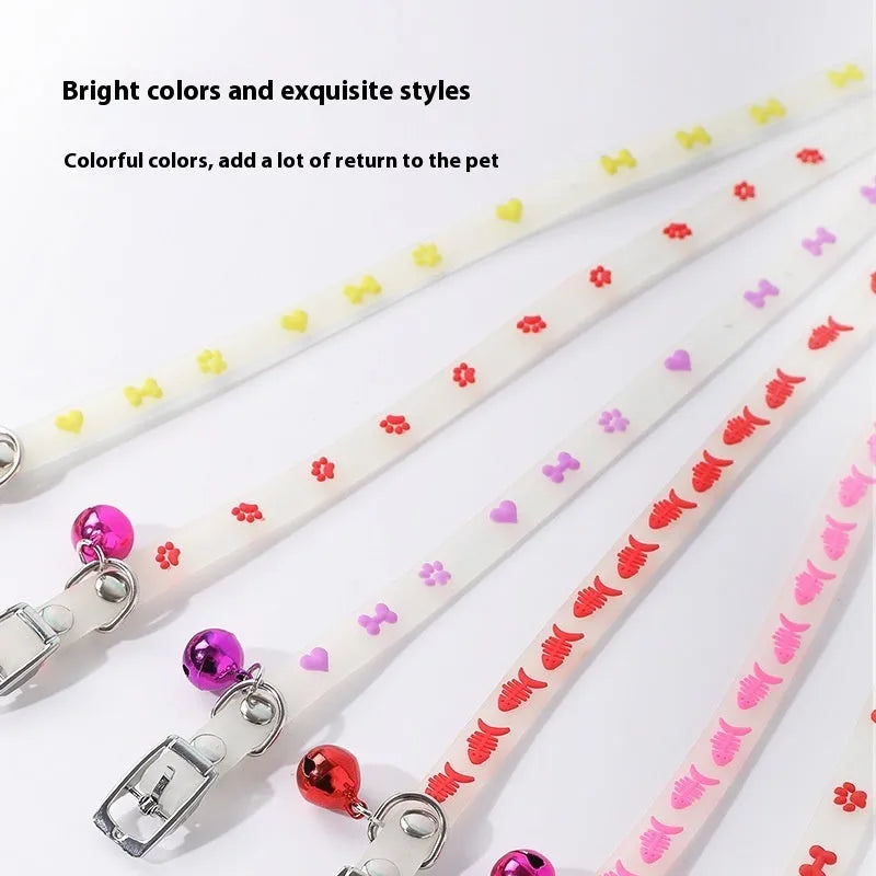 Luminous cat collar with adjustable silicone strap and metal bell in paw print pattern