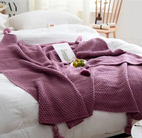 Nordic fringed knit ball acrylic blanket in beige colour showing texture detail and 130x170cm size