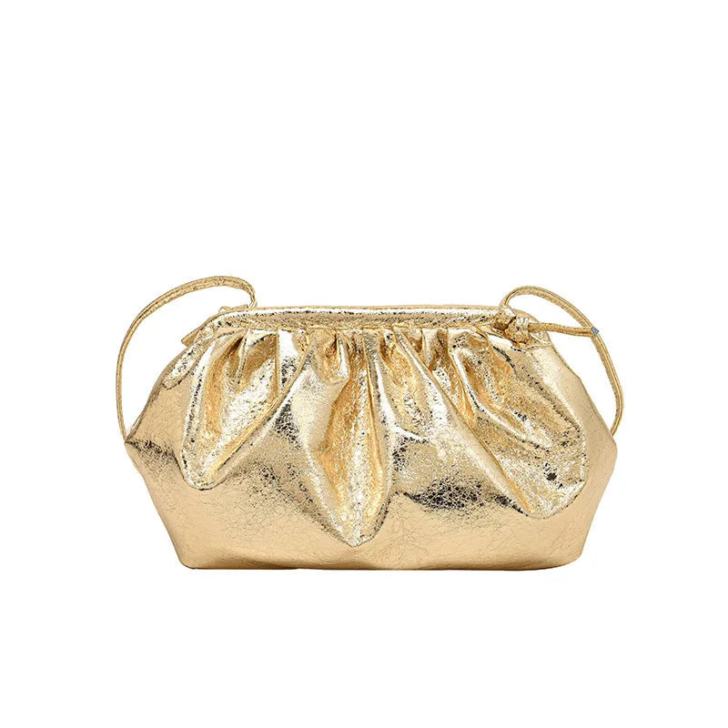 Simple hair clip fastening crossbody bag in shell shape, shown in rose red colour.