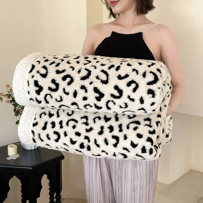 Double-layer cationic leopard jacquard taffeta blanket showing leopard print pattern in camel colour.