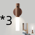 Compact wooden and acrylic motion sensor LED desk lamp on a desk