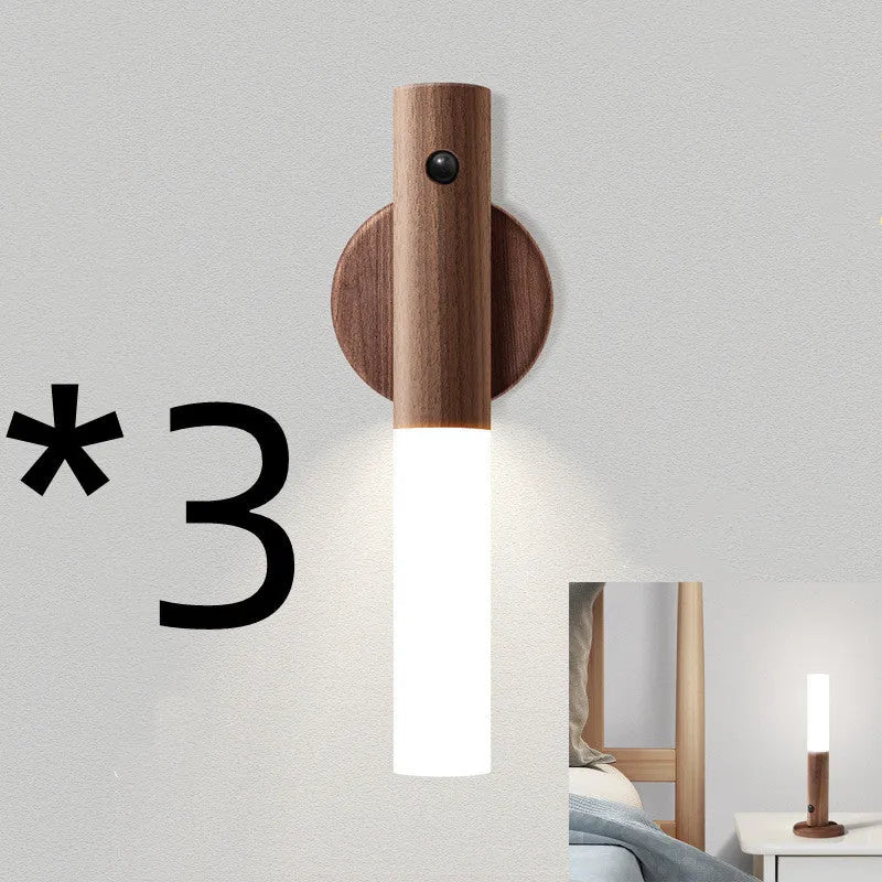 Compact wooden and acrylic motion sensor LED desk lamp on a desk