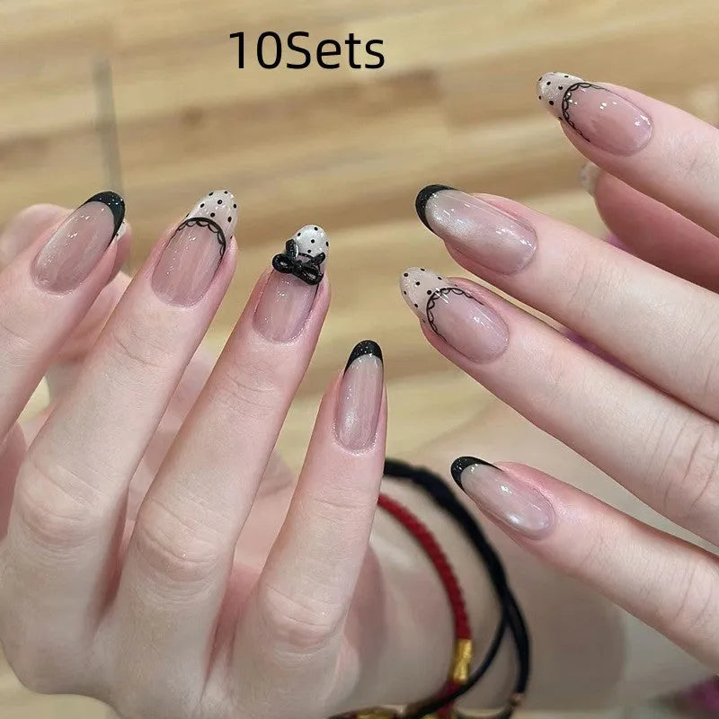 False nails sets for girls showing floral and glitter designs on short oval and stiletto nail shapes