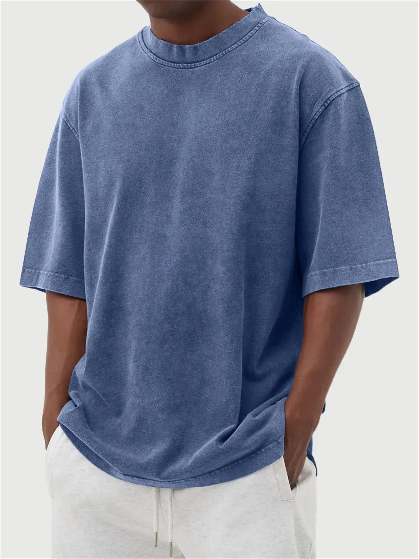Men's loose fit distressed pullover t-shirt in stone washed polyester showing half sleeve design