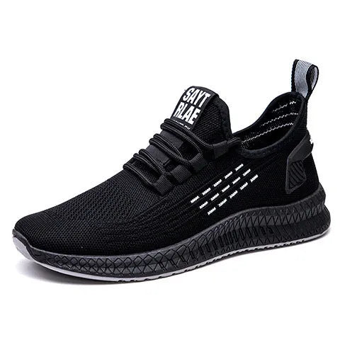 Men's black casual sports shoes with Flying Weave upper and flat low-heel profile.