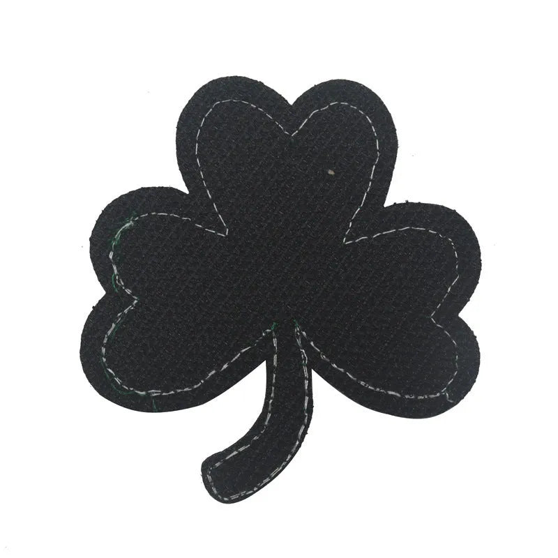 Outdoor embroidered fabric badge with Velcro backing on a tactical vest.
