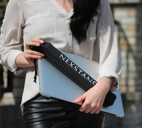 Black folding portable laptop stand made of reinforced nylon, shown both open for use and folded flat.