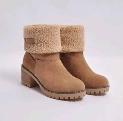 Women's black suede mid-tube knight snow boots with a thick sole and low flat heel on a plain background.