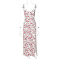 Blue lace flowers print long dress with spaghetti straps and a high leg slit on a mannequin.
