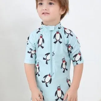 Boys' penguin pattern swimsuit set with long sleeves and matching swimming cap