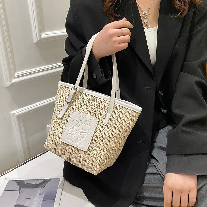 Straw woven women's shoulder bag in retro style with three-dimensional pocket