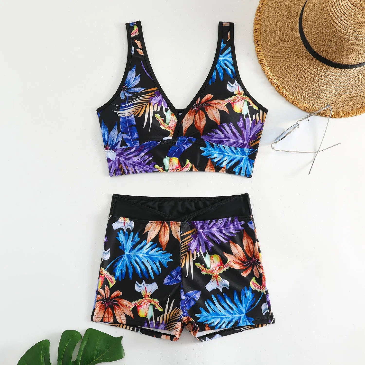 Women's two-piece sleeveless swimsuit with boxer shorts in a multi-colour print.
