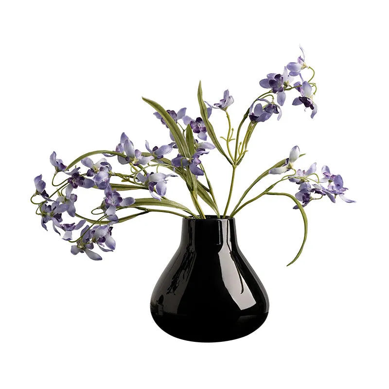 Black ceramic round belly French design vase with two white orchid flowers