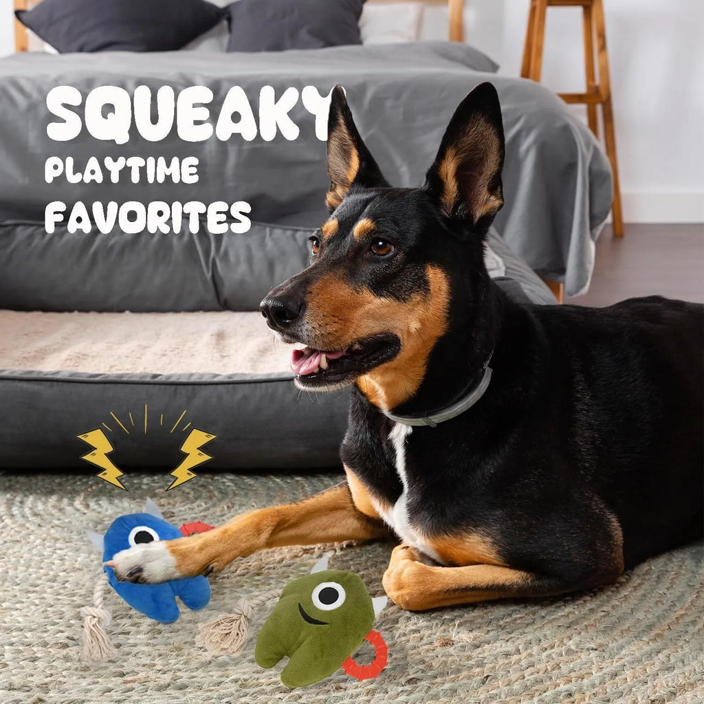 Blue and green monster-themed stuffed plush dog toy with integrated cotton rope and a squeaker.