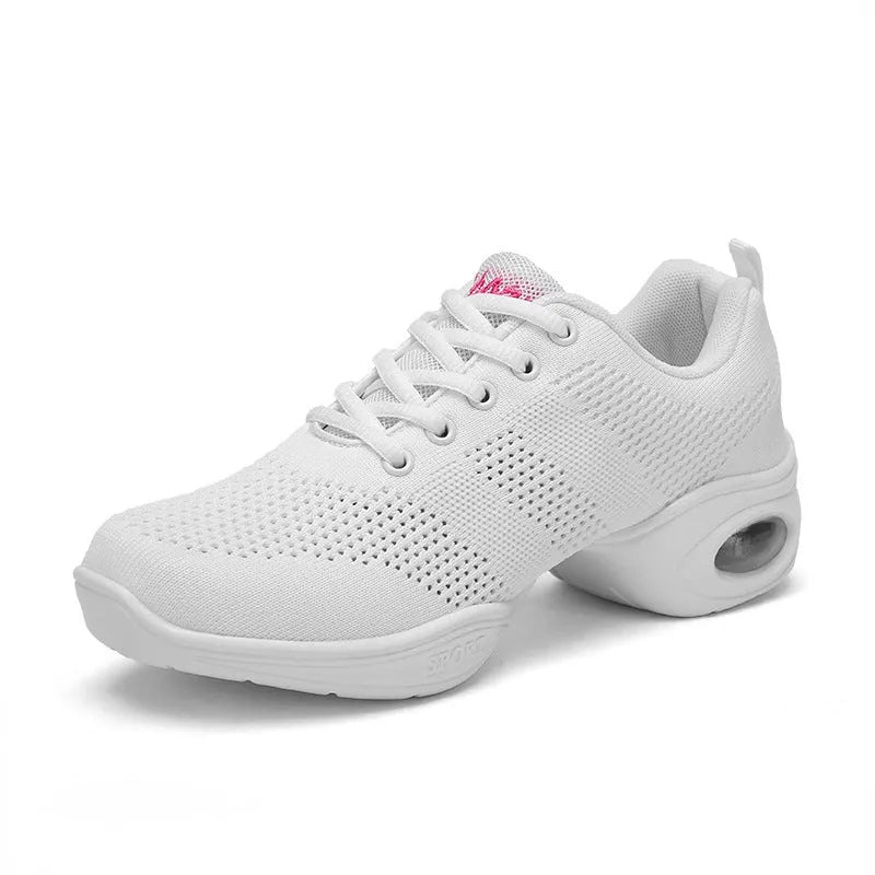Women's white breathable fly woven mesh dance shoes with soft PU sole on a wooden floor.