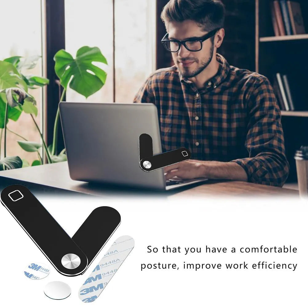 Black aluminum laptop phone holder with magnetic mount attached to computer monitor