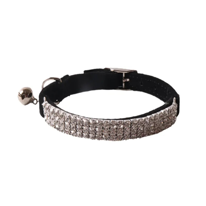 Soft pink flocking cat collar with silver elastic buckle, shown adjusted to fit.