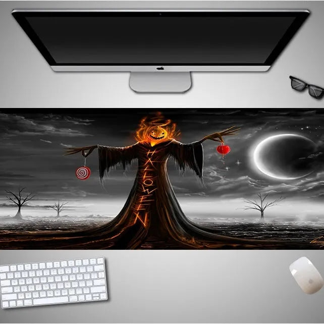Oversized Halloween-themed computer mouse pad with non-slip rubber cloth base on a desk