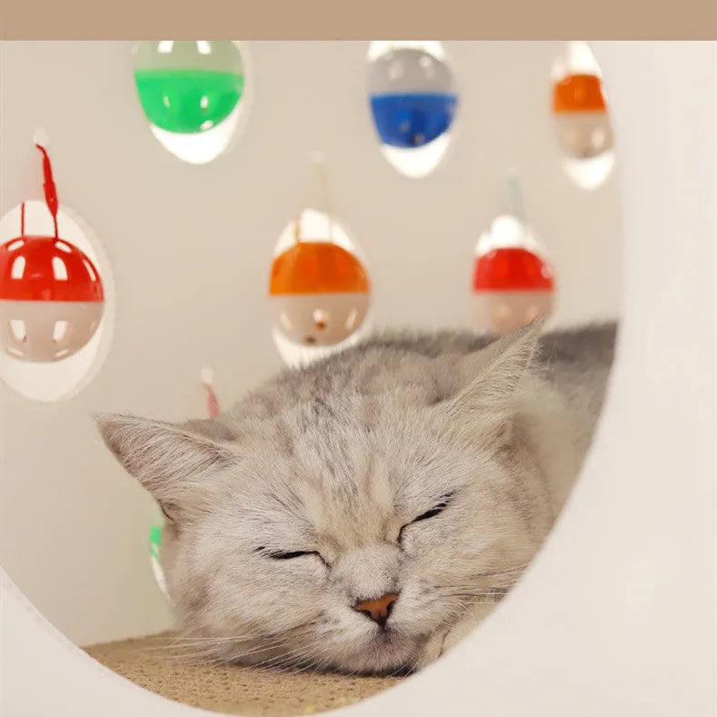 Plastic cat scratch board house with integrated nest bed, bell ball toy, and tunnel opening for indoor feline use