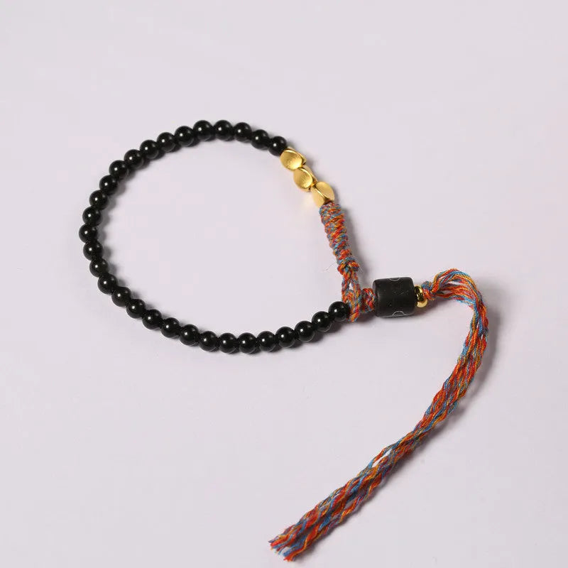 Hand-woven obsidian carrying strap showing texture and 4mm width