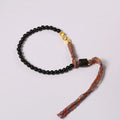 Hand-woven obsidian carrying strap showing texture and 4mm width