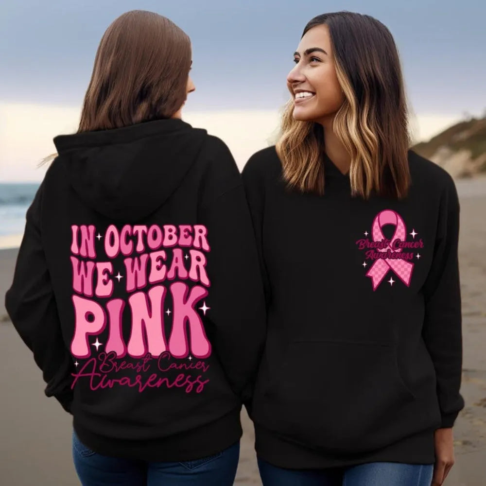 Breast Cancer Awareness pullover hoodie with retro art print and side seam pockets, shown in pink.