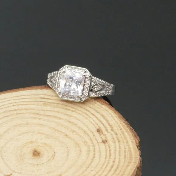 Platinum geometric zircon ring with hollow quadrilateral design on copper base