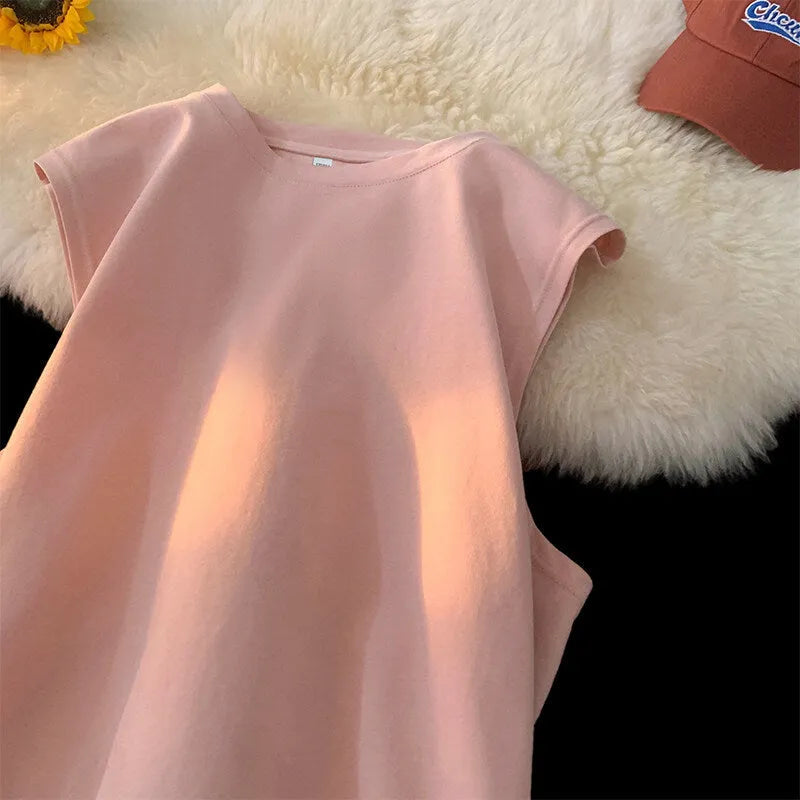 Men's solid colour loose fit cotton tank top on a hanger, showing straight hem and sleeveless design.