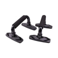 Pair of black I-shaped push up bars with textured PP sponge grips on a floor